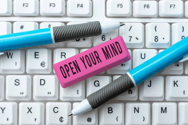 Handwriting text Open Your Mind, Business concept Be openminded Accept new different things ideas situations Businessman Holding Mobile Phone With Important Messages And Pointing On It