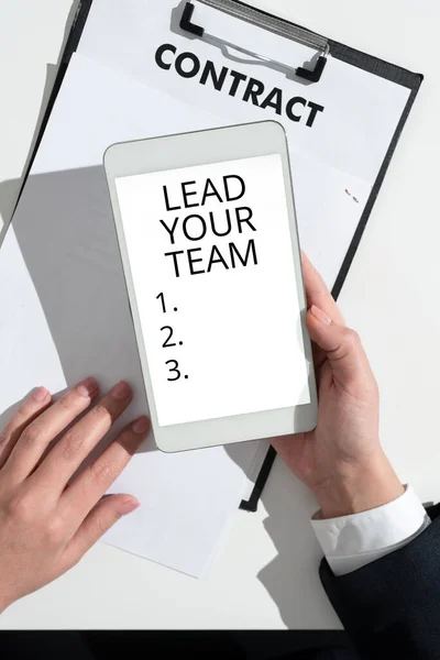 Conceptual display Lead Your Team, Business concept Be a good leader to obtain success and accomplish goals Businessman Holding Mobile Phone With Important Messages And Pointing On It