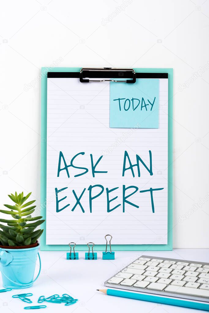 Sign displaying Ask An Expert, Word for Asking for advice to someone with great knowledge in a subject Important Messages On Notebook And Lap Top On Desk With Office Supplies.
