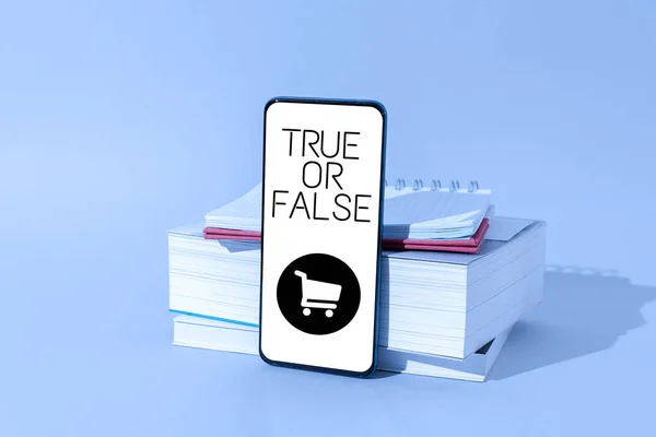 Conceptual display True Or False, Business concept Decide between a fact or telling a lie Doubt confusion Man studying book learning new business strategies to achieve goals.