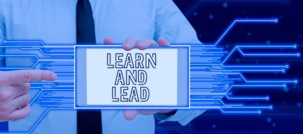 Conceptual caption Learn And Lead, Business approach Improve the skills and knowledge to fit for the leadership Man With Futuristic Jigsaw Piece Presenting Business Strategies.
