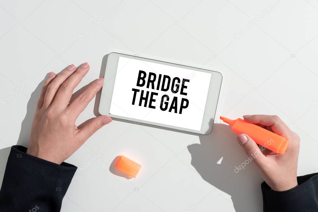 Writing displaying text Bridge The Gap, Business overview Overcome the obstacles Challenge Courage Empowerment Lady in suit holding pen symbolizing successful teamwork accomplishments.