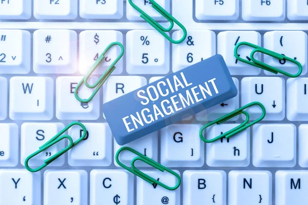 Text sign showing Social EngagementDegree of engagement in an online community or society, Concept meaning Degree of engagement in an online community or society