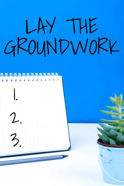 Hand writing sign Lay The GroundworkPreparing the Basics or Foundation for something, Business concept Preparing the Basics or Foundation for something