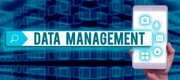 Hand writing sign Data ManagementThe practice of organizing and maintaining data processes, Business approach The practice of organizing and maintaining data processes