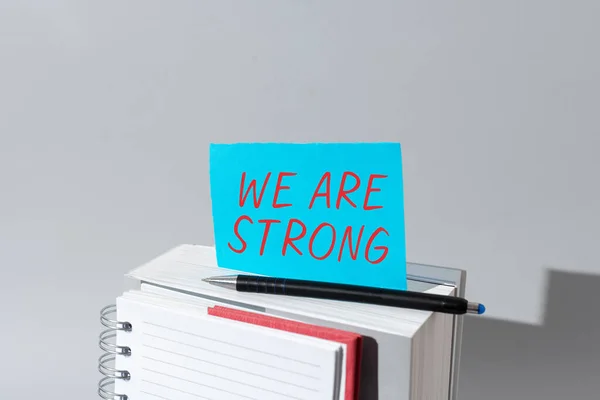 Writing displaying text We Are Strong, Business idea Have great strength healthy powerful achieving everything