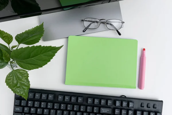 Office Supplies Over Desk With Keyboard And Glasses And Coffee Cup For Working