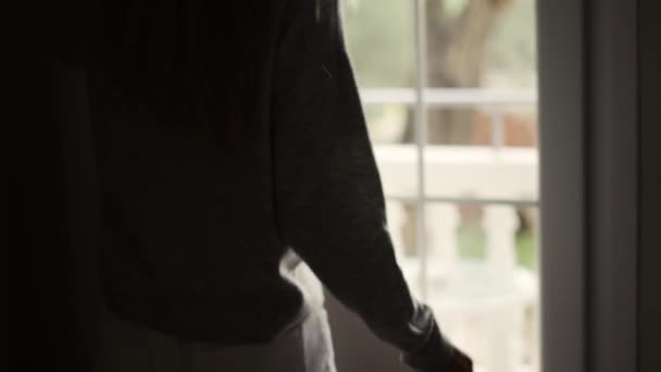 Woman opening curtains in hotel room going out on the balcony, close up — Stock Video