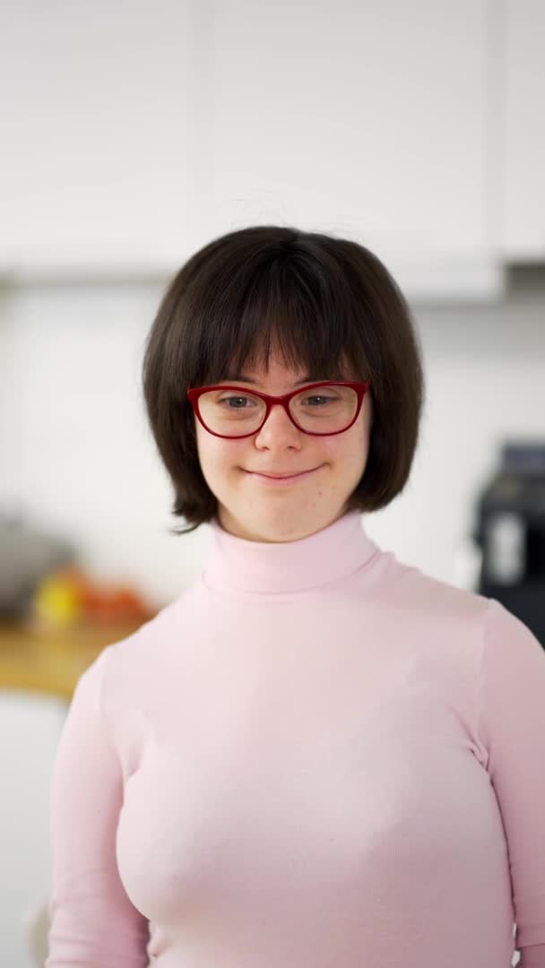 Portrait of kid with special needs smiling at camera at home — Video Stock