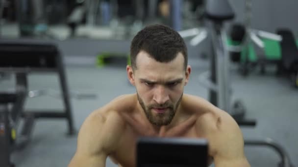Shirtless Athlete Training Rowing Machine Exercise Intense Endurance Workout — Stock Video