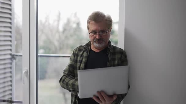 Senior Older Mature Man Typing Laptop Browsing Internet Standing Next — Stock video