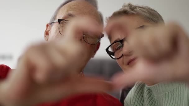 Older Retired Couple Making Heart Hands — Stockvideo