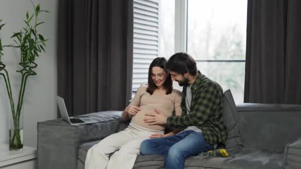 Pregnant Woman Large Belly Husband Sitting Sofa Waiting Movements — Vídeo de Stock