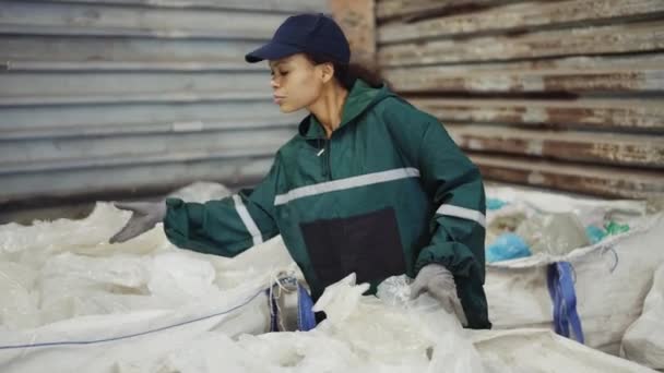 African American Woman Special Uniform Sorts Polyethylene Waste Recycling Plant — Stock Video