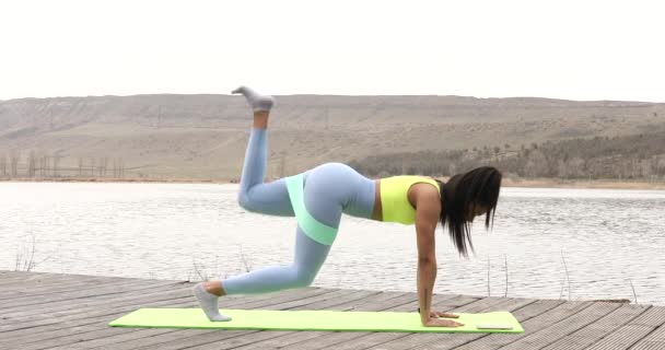 Fitness Trainer Rubber Sports Belt Hips Performs Lunges While Standing — Stock Video