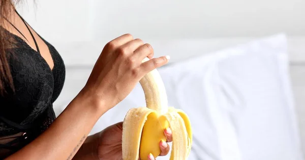 Cropped Shot Young Woman Underwear Eating Banana Bedroom — ストック写真