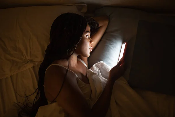 Close Portrait African American Woman Looking Phone While Lying Bed — Stockfoto