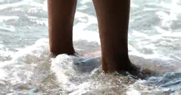 Girl Standing Rocky Beach Waves Washing Feet Beach Summer Holiday — Wideo stockowe
