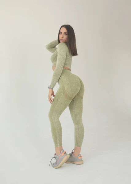 Beautiful Young Woman Dressed Green Sports Uniform Posing Studio Grey — Foto de Stock