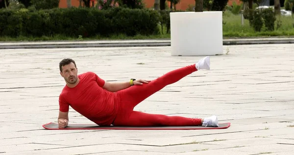 Muscular Sportsman Stretching Out Sports Training Park —  Fotos de Stock