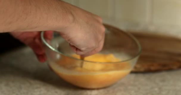 Person Breaking Whisking Egg Big Glass Bowl Cooking Omelet Breakfast — Stock Video