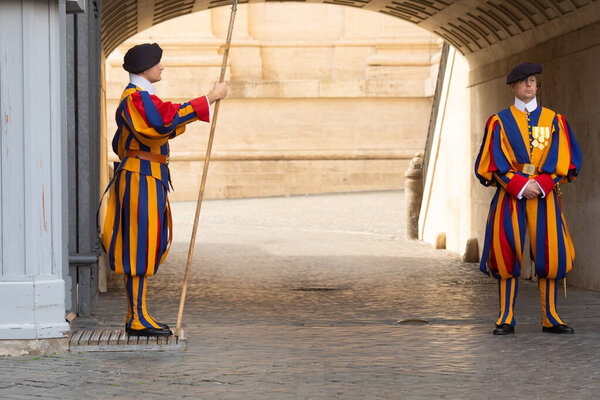 Vatican, Rome, Italy - 12.10.2022: Guardsmen on duty at the entrance to the Vatican. Vatican soldiers. Swiss Guard of the Vatican. 