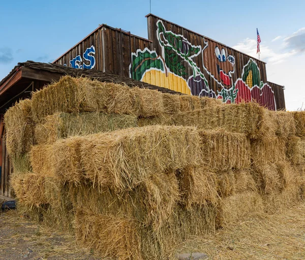 Hay pile at the countryside. Hay bale is placed in a rural market of a town. Street view, travel photo, selective focus, concept photo agriculture