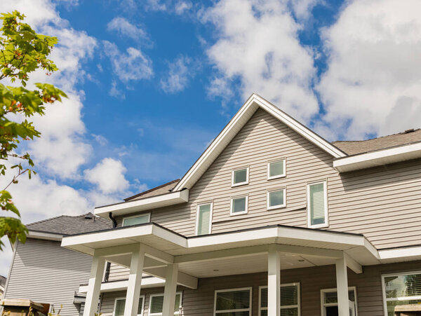 Neighborhood modern houses in BC, Canada. Canadian modern residential architecture. Facade of the house. Nobody, street photo
