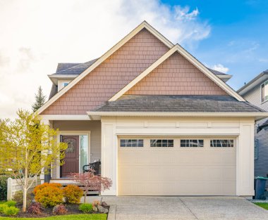 Luxury house in Vancouver, Canada. Big luxury house with a patio in a sunny day. Selective focus, nobody.