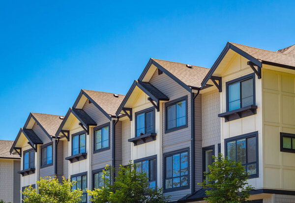 New Modern Apartment Buildings in Vancouver BC. Canadian modern residential architecture. Architectural details of modern apartment building in sunny summer day. Nobody, street photo-June 24,2022