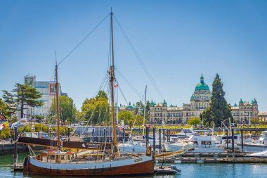 Victoria, British Columbia, Canada. Victoria Harbour with yachts and historical Buildings at sunny summer day. Inner Harbour, Popular tourist destination with eco-tours, unique shops-July 19,2022