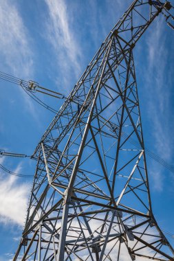 Electric power. High voltage post or High voltage tower in the blue sky background, nobody