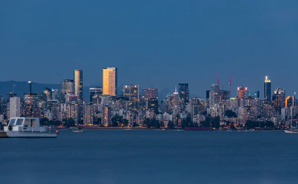 Vancouver BC Canada Skylines at Night. Vancouver is the third most populous metropolitan area and is the most ethnically diverse cities in Canada-July 24,2022-Travel photo, nobody, long exposure