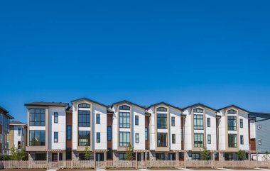 Neighborhood new modern houses building in BC, Canada. Canadian modern residential architecture. Nobody, street photo-August 6,2022-Vancouver BC, Canada.