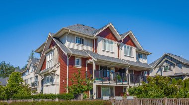 Typical house in Vancouver, Canada. Big luxury house with a patio on sunny summer day. Selective focus, nobody.