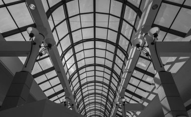 Skylight inside the mall. Interior of main hall shopping mall with large skylight with natural light from glass roof. Abstract, nobody, modern architecture
