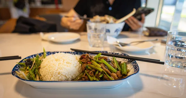 Asian food in a plate with rice. Various of asian meals at the restaurant , top view , place for text. Asian food concept. nobody.