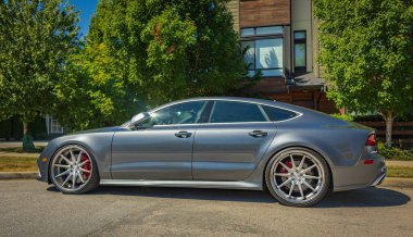 A new Audi RS 7. Grey satin audi sportscar outdoor on sunny day. Vancouver BC Canada-August-6,2022. Editorial, nobody, blurred, selective focus