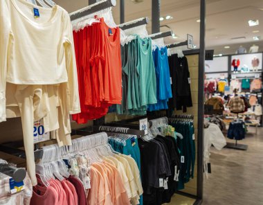 Modern fashionable brand interior of clothing store inside shopping center. Fashion stylish luxury clothes display-August 2,2022-Richmond BC Canada. Editorial