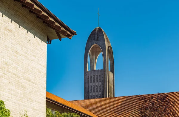 Bell tower of ancient church, isolated on blue sky. Westminster Abbey Cathedral, Canada, Seminary of Christ the King-August 8,2022-Nobody, travel photo