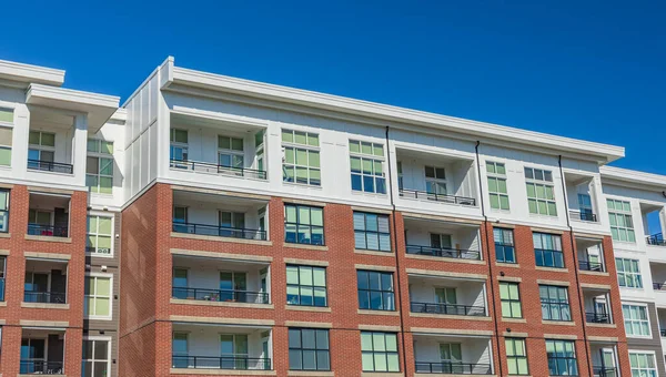 Neighborhood new modern houses building in BC, Canada. Canadian modern residential architecture-Vancouver BC, Canada. Nobody, street photo. Brand new apartment building on sunny day