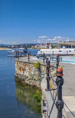 Cityscape of the Inner Harbour in Victoria BC, Canada during summer Holidays. Popular tourist destination with eco-tours, unique shops, food near the parliament buildings-July 20,2022-Travel photo