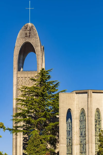 Bell tower of ancient church, isolated on blue sky. Westminster Abbey Cathedral, Canada, Seminary of Christ the King-August 8,2022-Nobody, travel photo