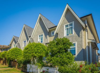 Big typical modern house in Vancouver, Canada. Canadian modern residential architecture on sunny summer day. Selective focus, nobody.