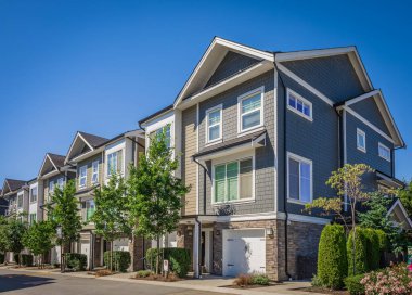 New Modern Apartment Buildings in Vancouver BC. Canadian modern residential architecture on sunny day. Nobody, street photo-Vancouver BC Canada