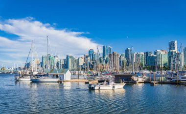 Beautiful cityscape of Vancouver. White Yachts in marina, British Columbia Canada. Vancouver Marina from Stanley Park. Travel photo, selective focus-September 3,2022