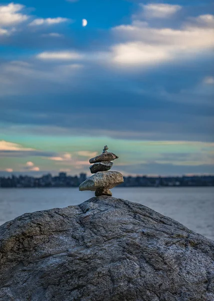 Expertly balanced stones on a Vancouver shoreline at sunset. Nobody, copy space for text, travel photo, concept photo relaxation and meditation
