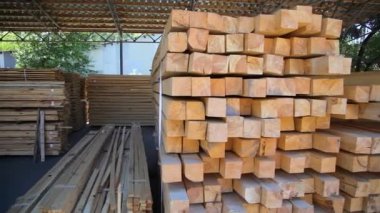 Wood warehouse. Sliced wooden boards are stored in a trading warehouse. Goods and materials arranged on a rack in warehouse.