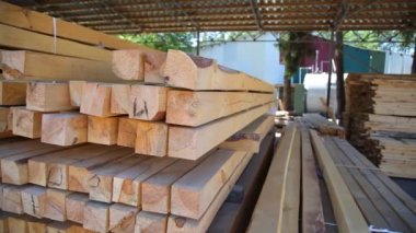 Wood warehouse. Sliced wooden boards are stored in a trading warehouse. Goods and materials arranged on a rack in warehouse.