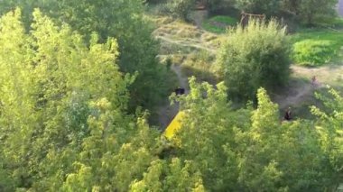 Budget glamping for family outdoor recreation. Glamping terrace in the forest. Glamping houses, rural landscape, tent houses.